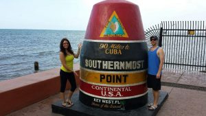 Math Teacher Bryan Cole standing next to the southernmost point of the continental USA.