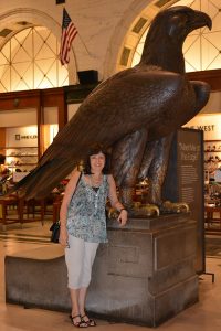 Spanish Teacher Marina Andueza "meets the eagle" at a Macy's in Philadelphia.