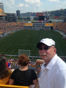English teacher Chip Carter watches the United States Women's National Soccer Team on their victory tour in Pittsburgh, Pennsylvania.