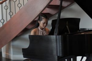 Photo credit: Phoung Dao Dao plays piano at one of her performances
