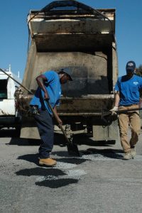 Photo Julia Grossman  Henrico County workers fill in the potholes 