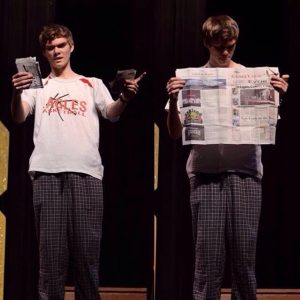 photo courtesy Davis West Davis West performing magic during Godwin’s annual Mr. MG pageant, 2017, a copy of the Eagles’ Eyrie in hand.